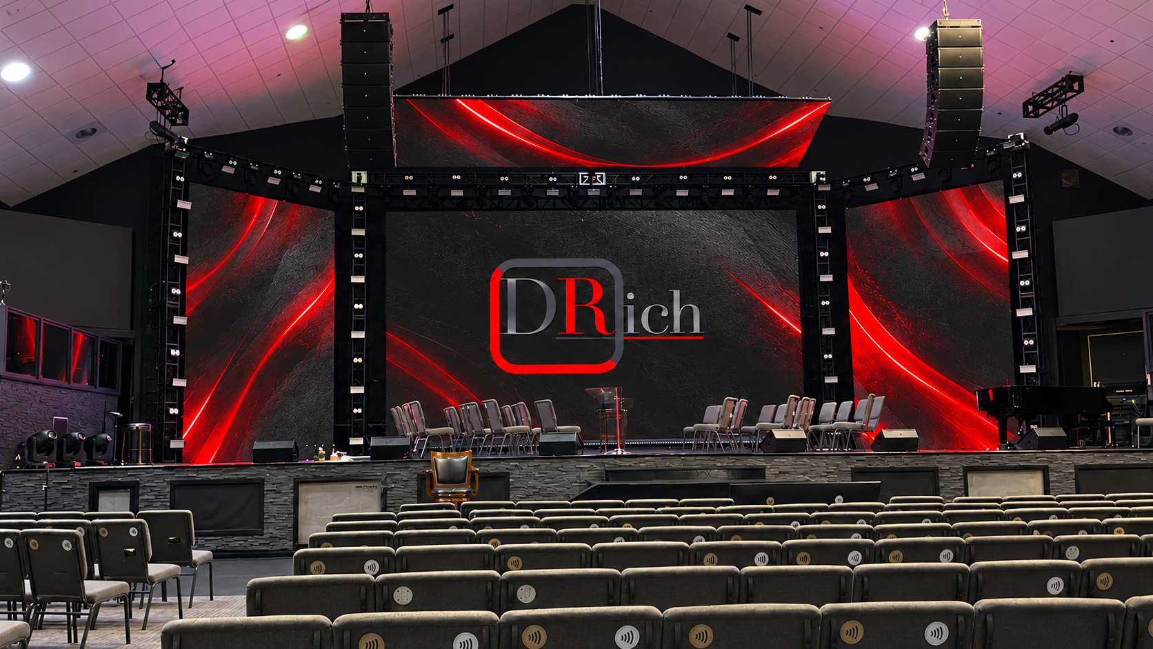 Brandywine auditorium with conceptual DRich graphics on the stage screens